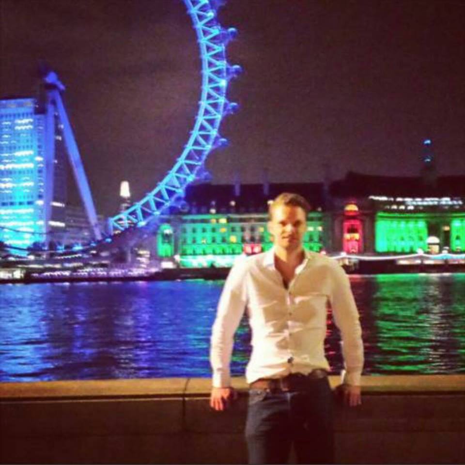 Darren Welch standing by the River Thames